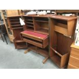 A Home office New Craft Ltd teak metamorphic desk