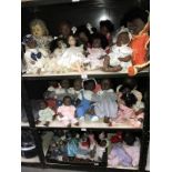 Over 40 assorted dolls including plastic baby dolls and porcelain headed collector's dolls (3