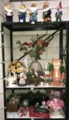 3 shelves of garden gnomes and Christmas decorations