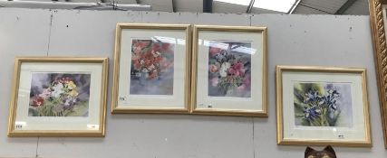 Four limited edition prints of flowers.