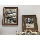 Two wooden framed, decorative, mirrors.