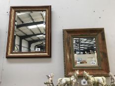 Two wooden framed, decorative, mirrors.