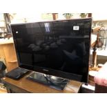 A Samsung flat screen tv and Toshiba DVD player.