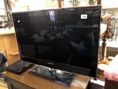 A Samsung flat screen tv and Toshiba DVD player.