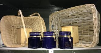 A set of London pottery storage jars and a vintage wicker basket