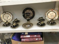 A shelf of Greek plates, cups and saucers etc.