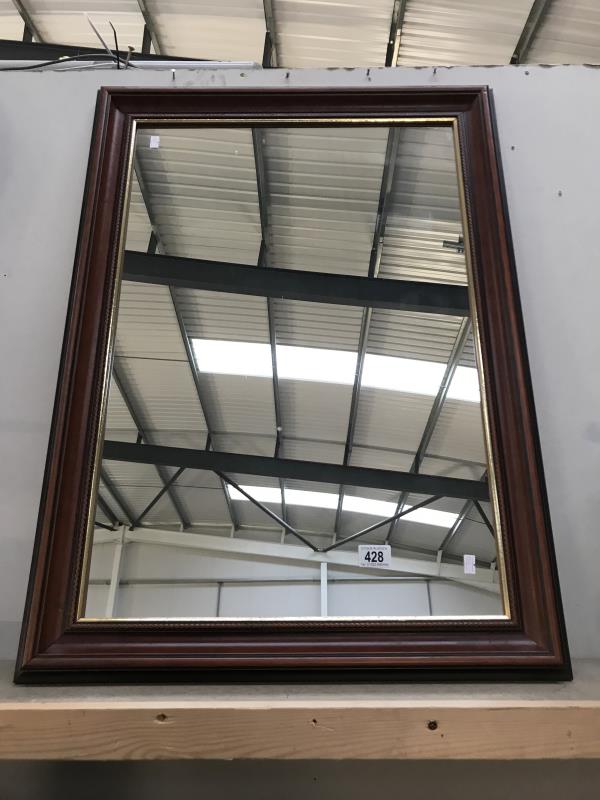 A wooden framed mirror