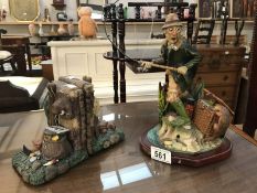 Pair of fishing themed book ends and a figure 'hooked on Fishing' by Brian Andrew,