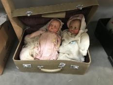 2 old dolls with painted eyes an shawls in case