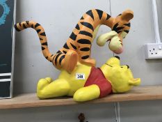 A large Pooh and Tigger statue