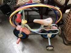 A childs bike and 2 hula hoops