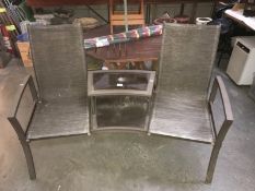 A 2 seat garden bench conjoined with a table