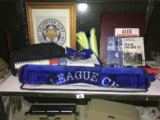 A shelf of football related items,