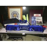 A shelf of football related items,