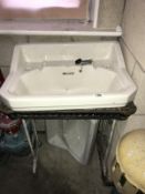 2 vintage sinks and a cast iron sink stand