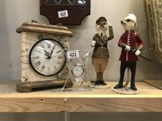 2 meerkat figures and 2 clocks