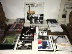 A quantity of cd's, DVD's and a book relating to Paul Weller, The Jam etc.