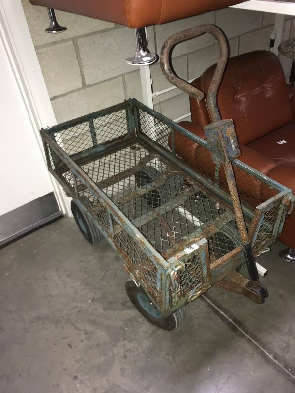 A metal 4 wheel trolley