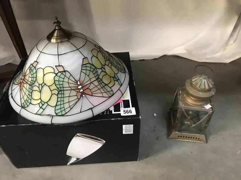 A modern glass light shade & small brass lantern