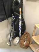 Set of 13 gold clubs in bag with trolley and a bag of approx.