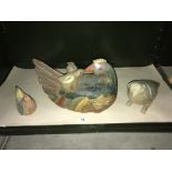 3 carved wooden birds