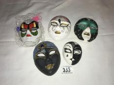 A quantity of decorative wall face masks