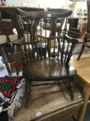 A dark wood cottage carver chair