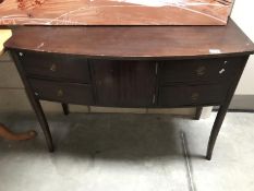 A darkwood stained sideboard