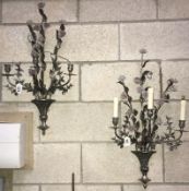 A pair of metal floral wall candle sconces