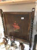 An oak fire screen with barley twist supports and ship decoration