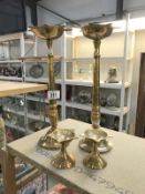 2 sets of brass candlesticks