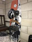 A snow board and a bicycle helmet