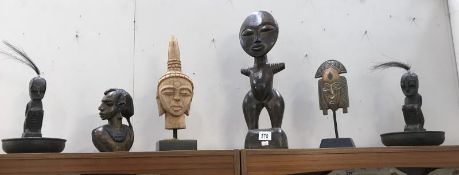 A quantity of tribal carvings