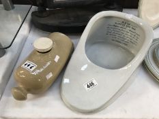 Stoneware hot water bottle and a slipper bath