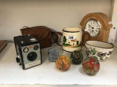 A quantity of miscellaneous. items including. Brownie camera, clock, paperweights, etc.
