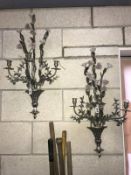 A pair of metal floral wall candle sconces