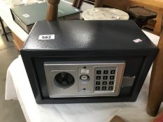 A small safe with keys (keys in office)