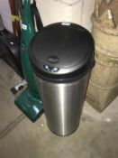 An electric bin (as new) & a touch pad panel phone