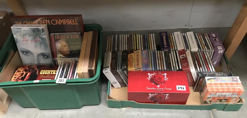 2 boxes of country music on cd's and cassette tapes