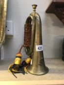 A bugle with later regimental badge and tassels