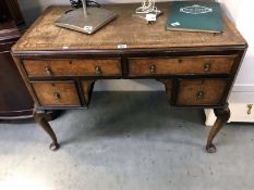 A vintage leather topped writing desk