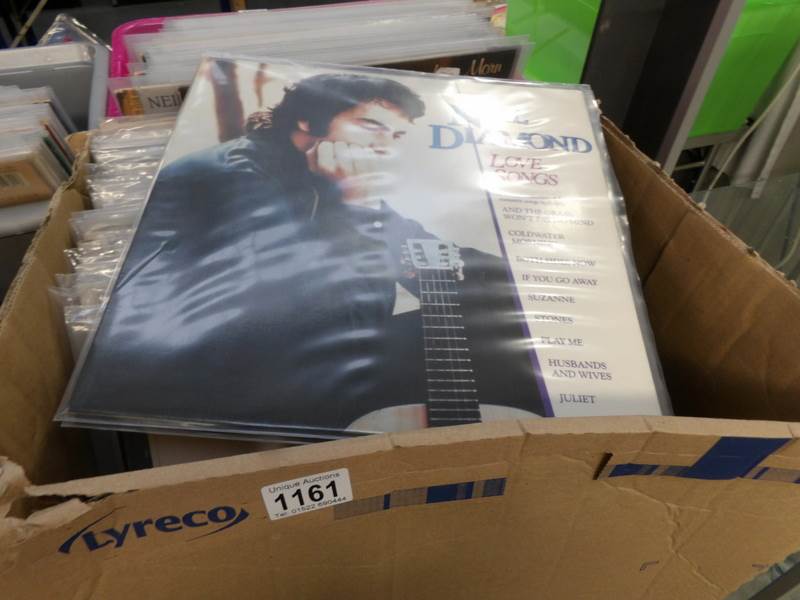 A box of mainly male singer records.