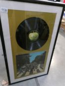 An Abbey Road disc in frame.
