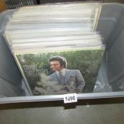 A box of mixed LP records, mainly male singers.