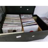 A box of 45 rpm records including Righteous Brothers, Simply Red etc.