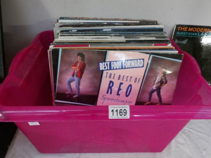 A box of in excess of 50 albums including Petshop Boys, Police, Status Quo, Fleetwood Mac etc.