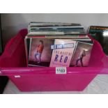 A box of in excess of 50 albums including Petshop Boys, Police, Status Quo, Fleetwood Mac etc.