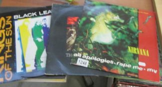 A mixed lot of 12" singles including Nirvana, Depeche Mode etc.