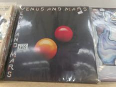 Paul McCartney 'Venus and Mars' with posters.