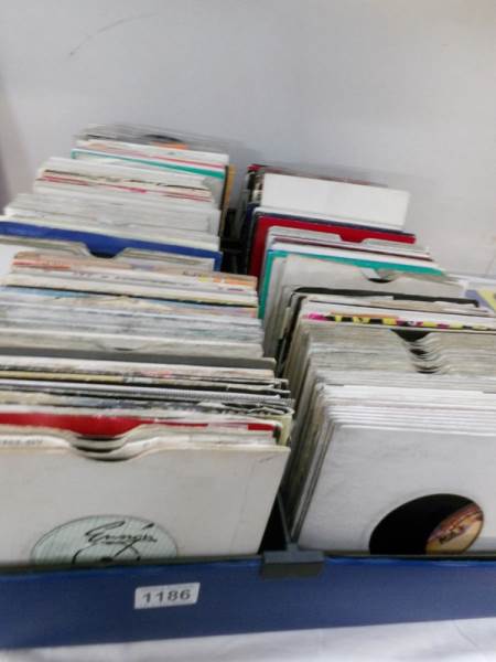 4 trays of 45's, disco soul, rock and pop records.